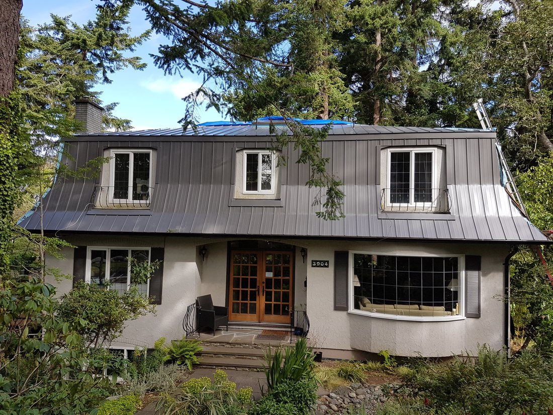 Completed roofline with gutters and trim on a Victoria area home